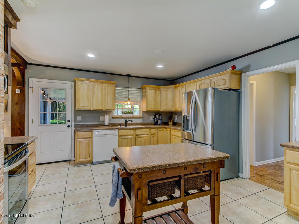 1041 Glen Echo Road Jacksonville, FL 32211 - Photo 11 of 40 a kitchen with stainless steel appliances granite countertop a refrigerator a sink a stove and island