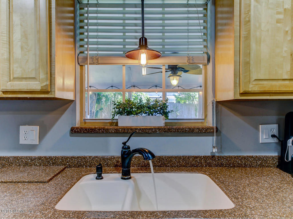 1041 Glen Echo Road Jacksonville, FL 32211 - Photo 15 of 40 a bathroom with a sink and a large window