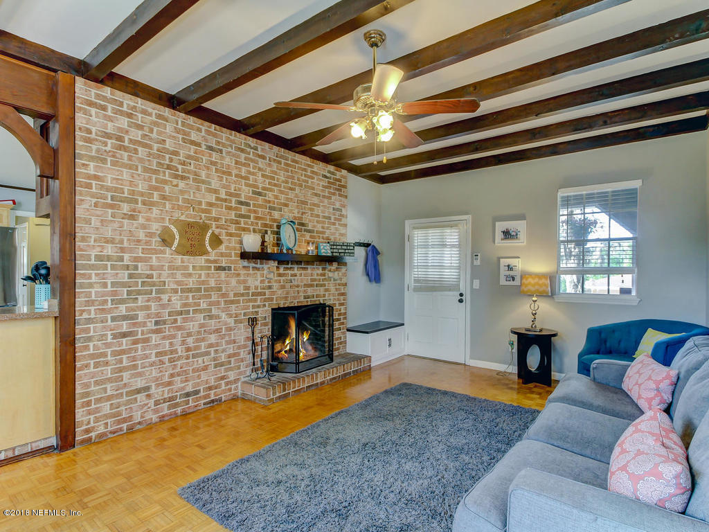 1041 Glen Echo Road Jacksonville, FL 32211 - Photo 17 of 40 a living room with furniture and a fireplace