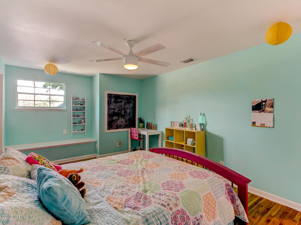1041 Glen Echo Road Jacksonville, FL 32211 - Photo 28 of 40 a bed room with a bed and a television