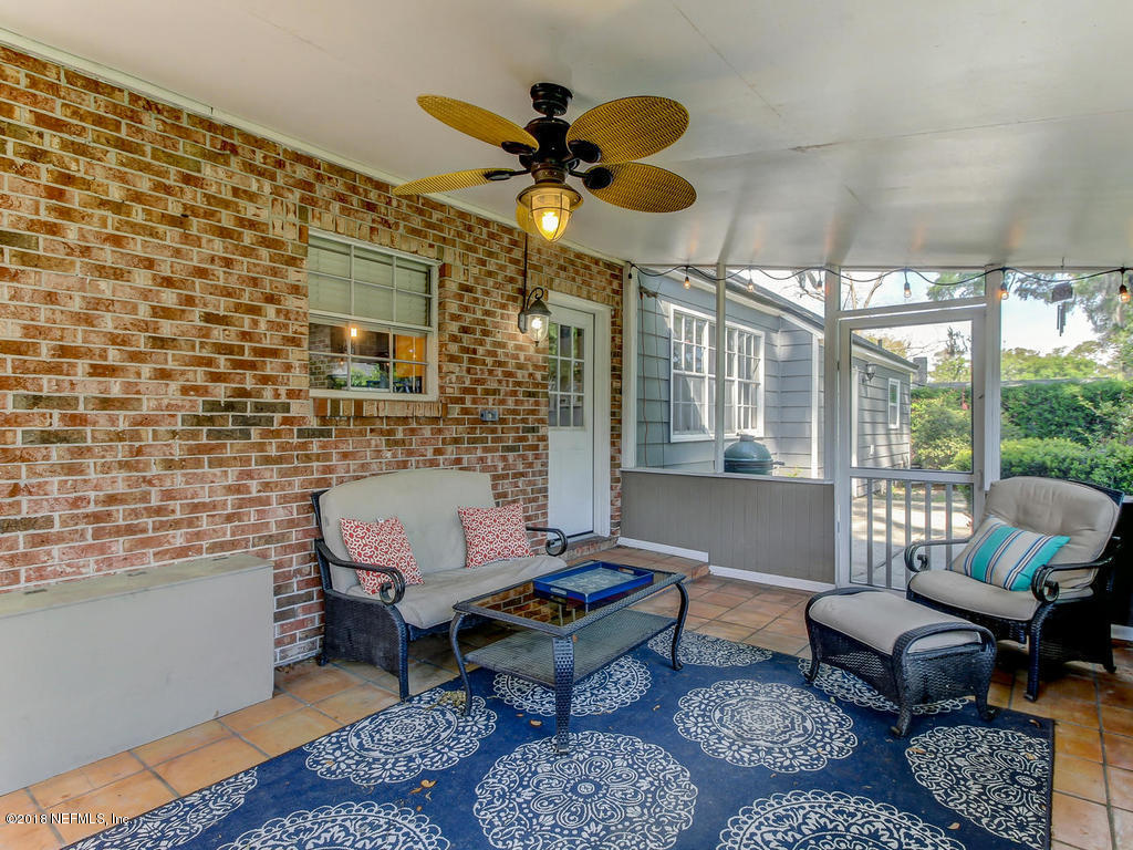1041 Glen Echo Road Jacksonville, FL 32211 - Photo 35 of 40 a living room with furniture a rug and a chandelier