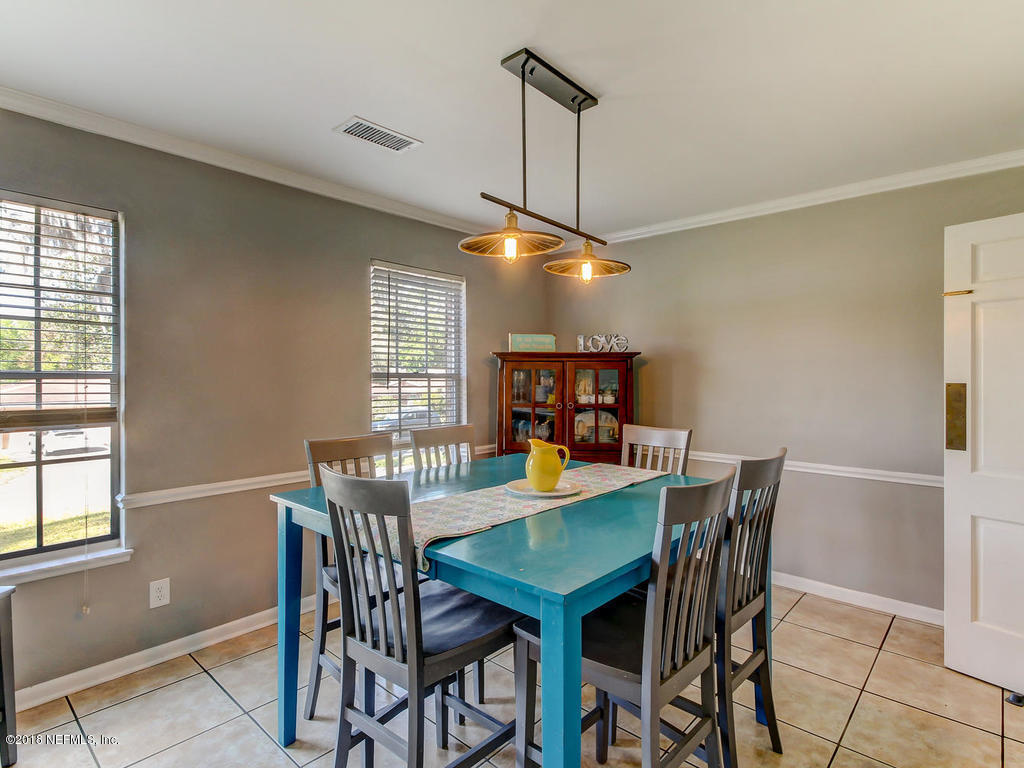 1041 Glen Echo Road Jacksonville, FL 32211 - Photo 9 of 40 a view of a dining room with furniture window and wooden floor