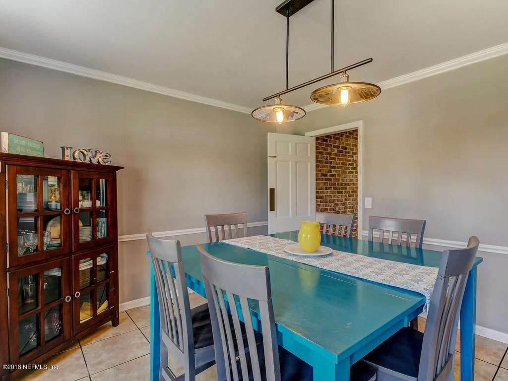1041 Glen Echo Road Jacksonville, FL 32211 - Photo 10 of 40 a view of a dining room with furniture window and wooden floor