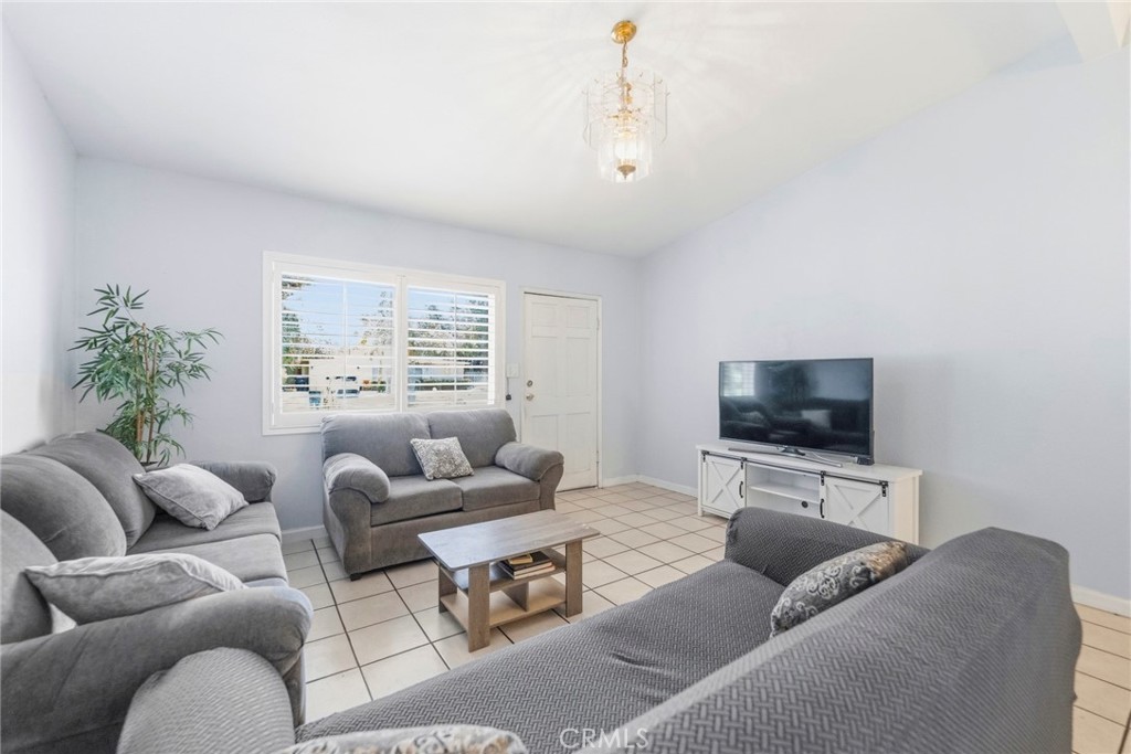 10363 Wagner Way Riverside, CA 92505 - Photo 4 of 26 a living room with furniture and a flat screen tv