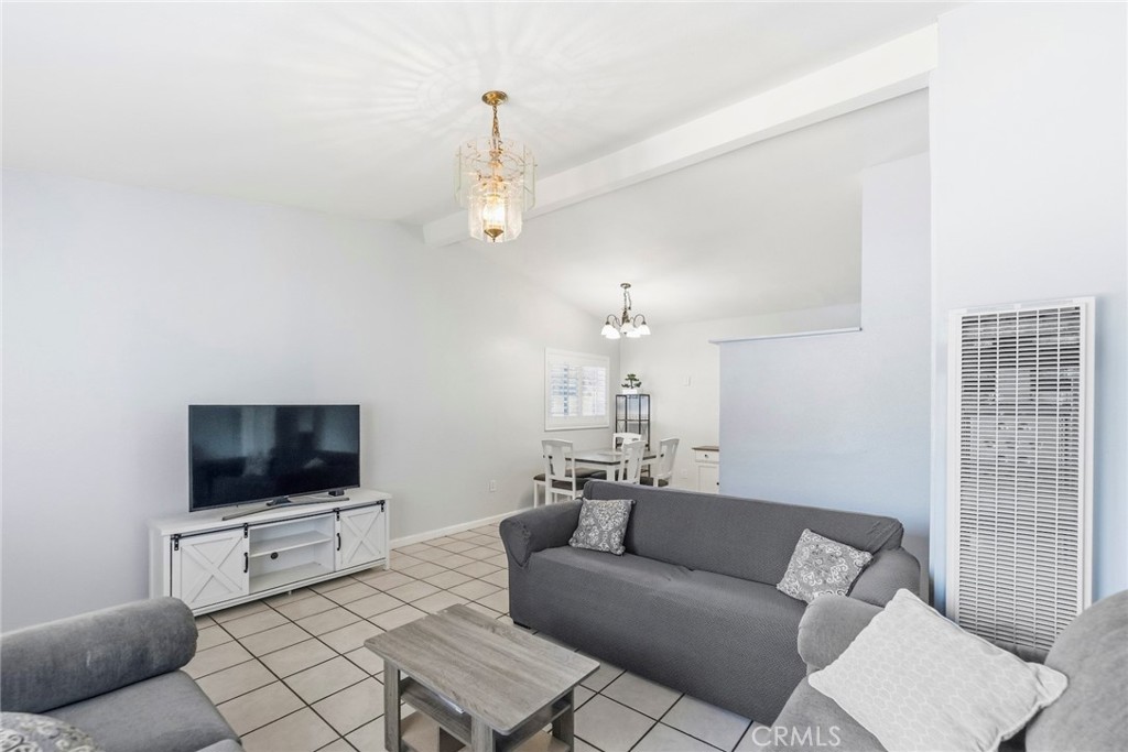 10363 Wagner Way Riverside, CA 92505 - Photo 5 of 26 a living room with furniture and a flat screen tv