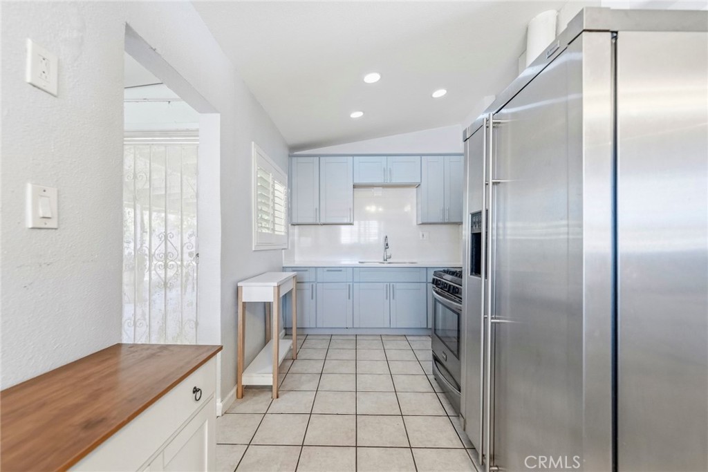 10363 Wagner Way Riverside, CA 92505 - Photo 8 of 26 a kitchen with stainless steel appliances granite countertop a refrigerator and a sink