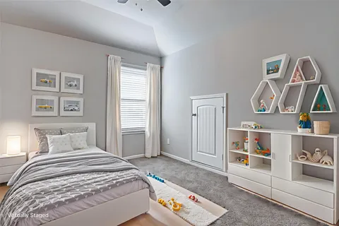 a bedroom with a bed and walk in closet