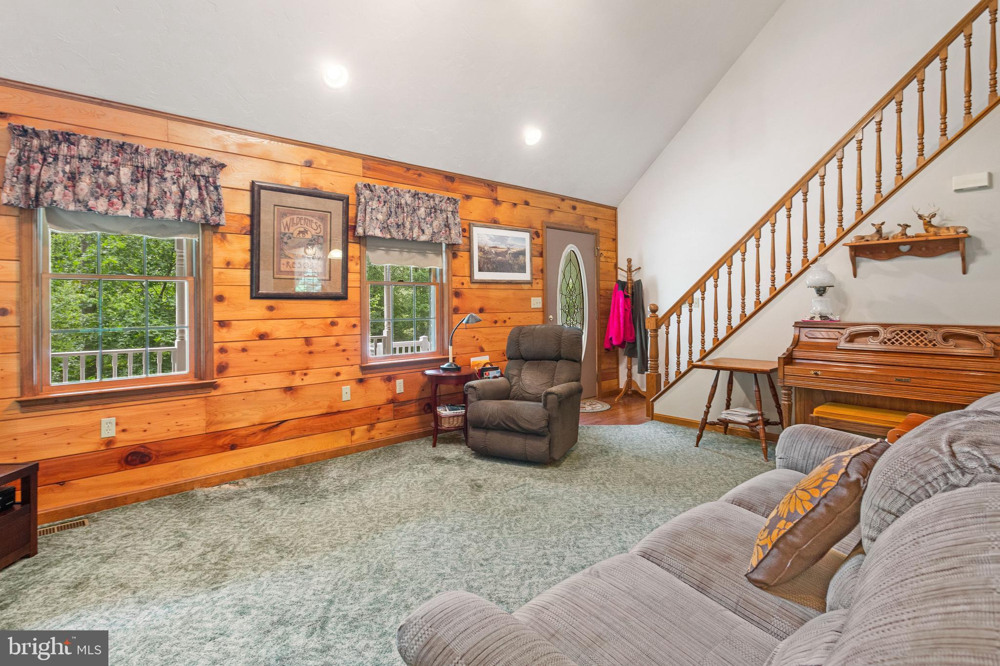 357 Lake Road Spring Grove, PA 17362 - Photo 15 of 35 a living room with furniture stairs and a window
