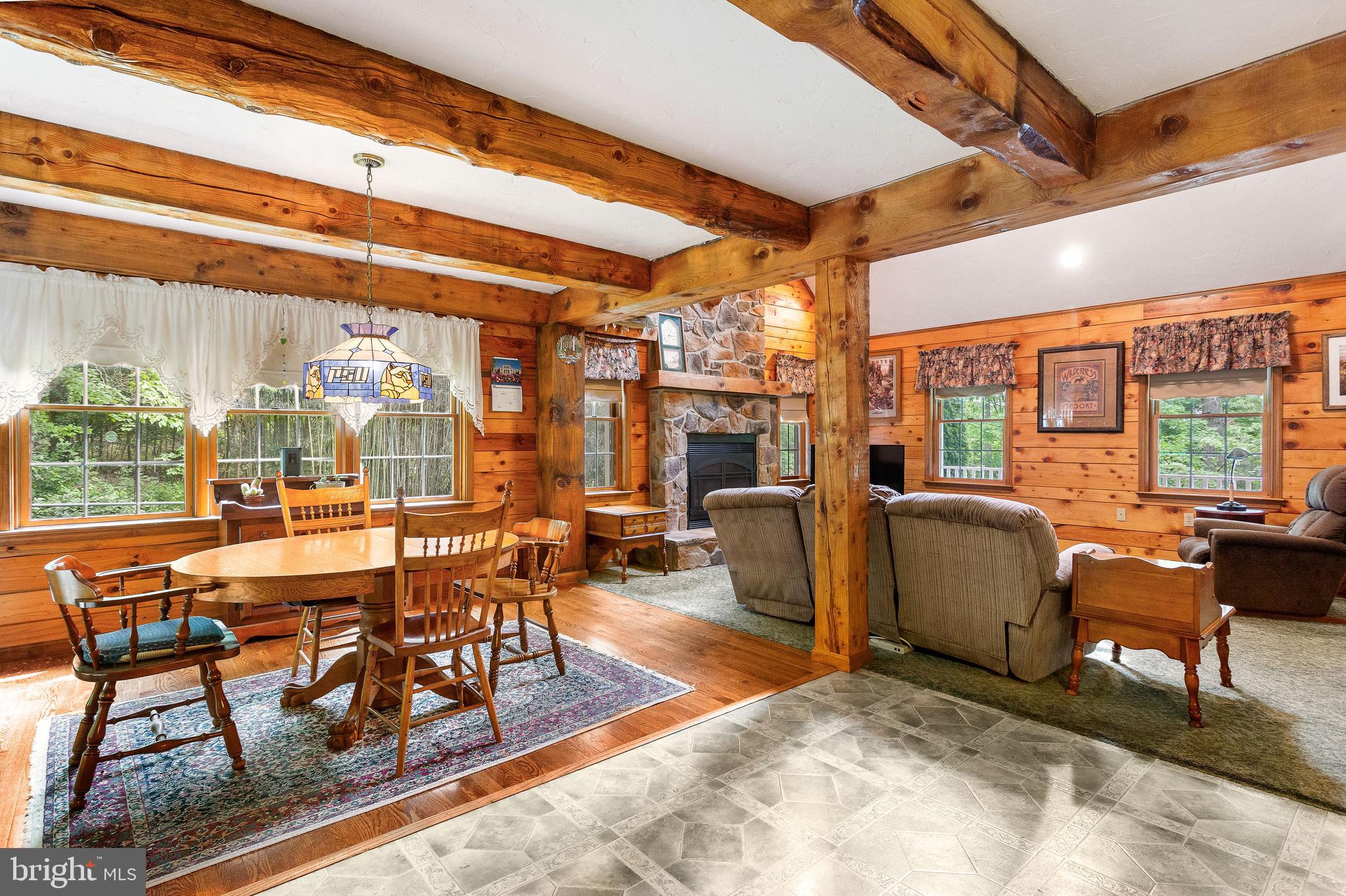 357 Lake Road Spring Grove, PA 17362 - Photo 18 of 35 a dining room with furniture large windows and wooden floor