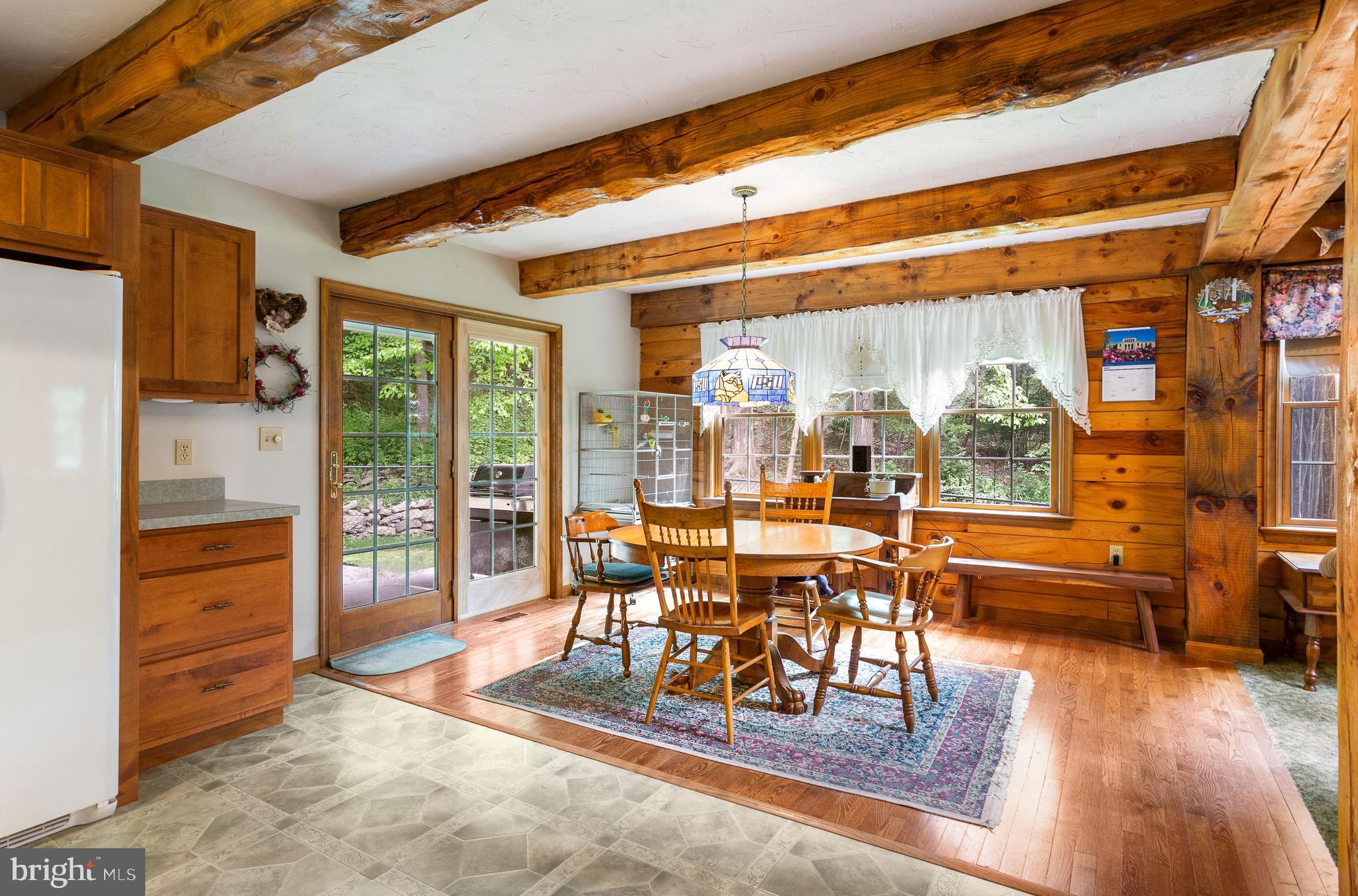 357 Lake Road Spring Grove, PA 17362 - Photo 19 of 35 a dining room with furniture water view and large windows