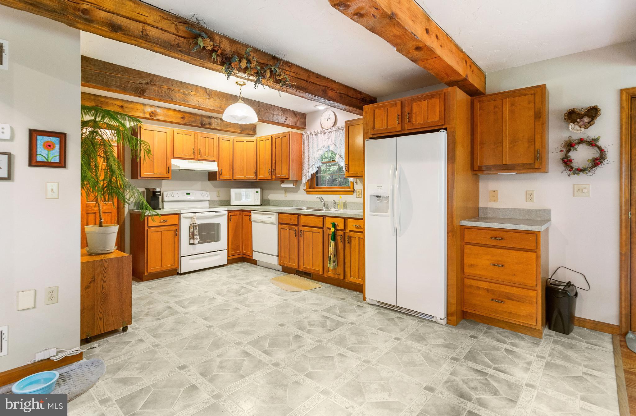 357 Lake Road Spring Grove, PA 17362 - Photo 20 of 35 a kitchen with stainless steel appliances granite countertop a stove and a refrigerator