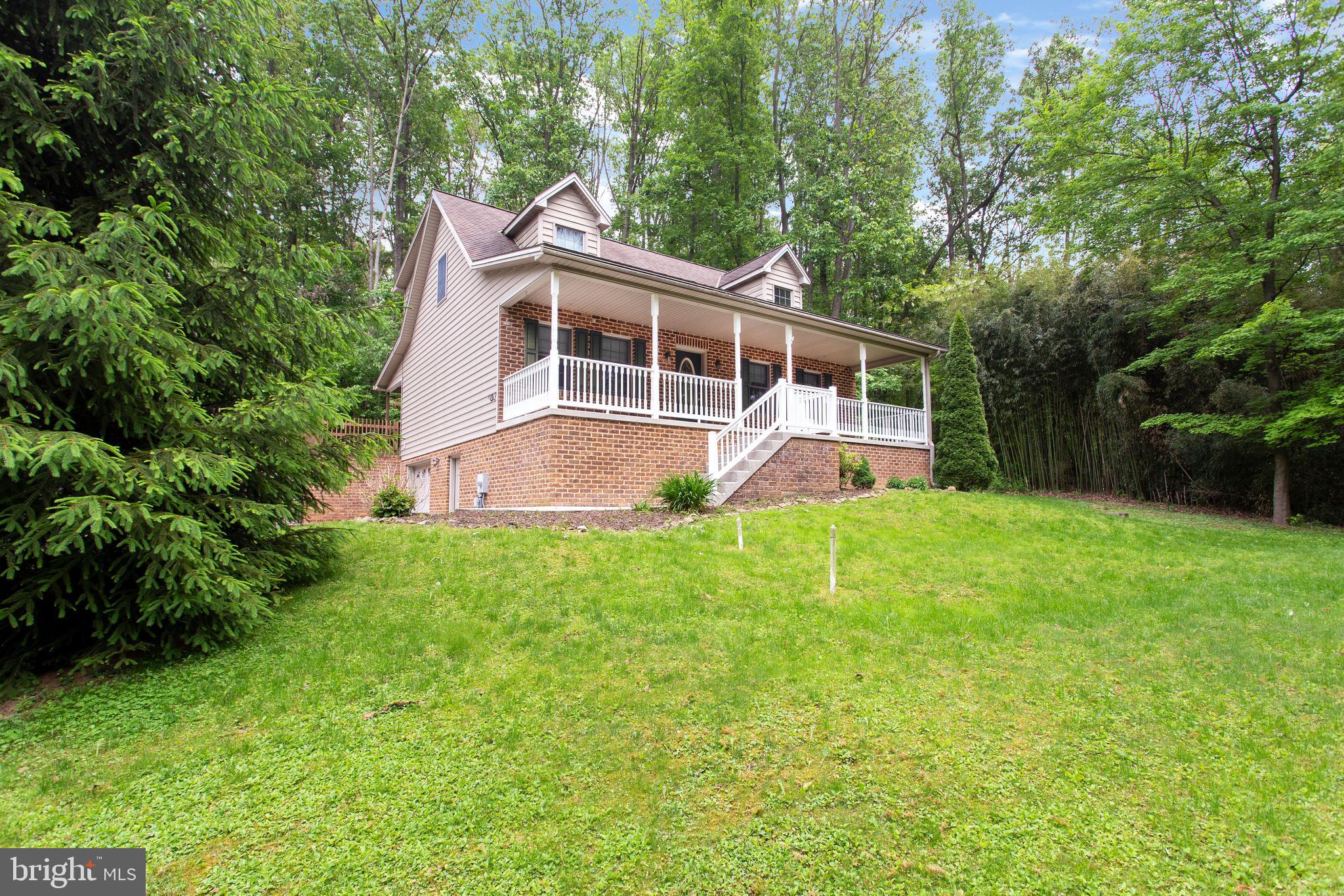 357 Lake Road Spring Grove, PA 17362 - Photo 4 of 35 a view of a house with a backyard and a patio
