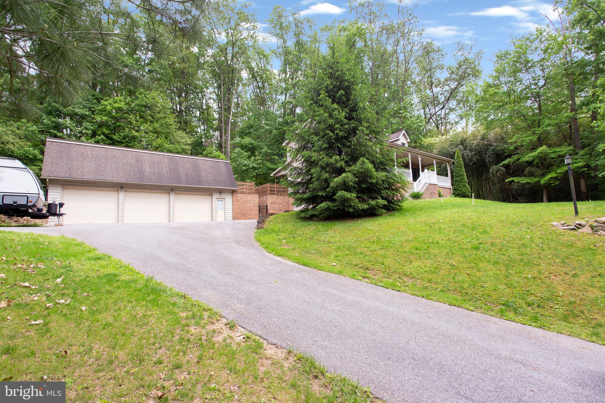 357 Lake Road Spring Grove, PA 17362 - Photo 5 of 35 a view of a backyard with a garden and entertaining space