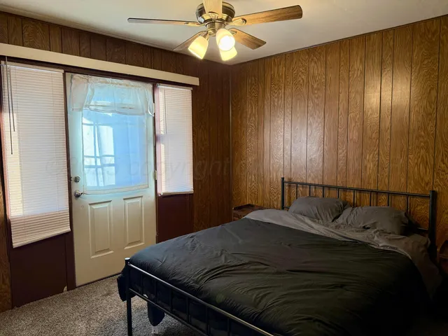 a bathroom with a double vanity sink a toilet and shower