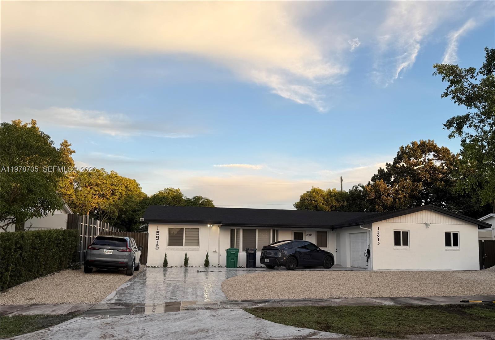 15915 Southwest 103rd Place Miami, FL 33157 - Photo 1 of 17 a view of house yard and front view of house