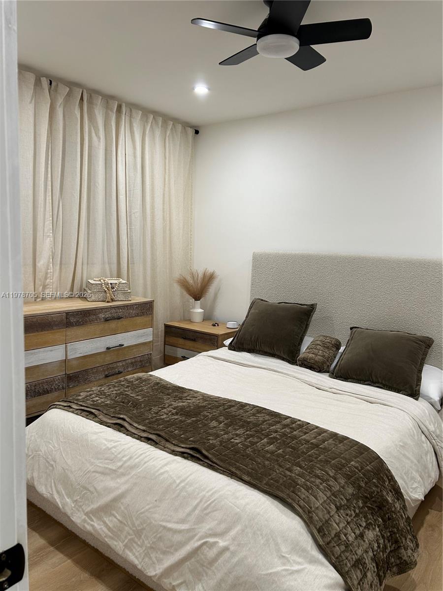 15915 Southwest 103rd Place Miami, FL 33157 - Photo 14 of 17 a bedroom with a bed and window