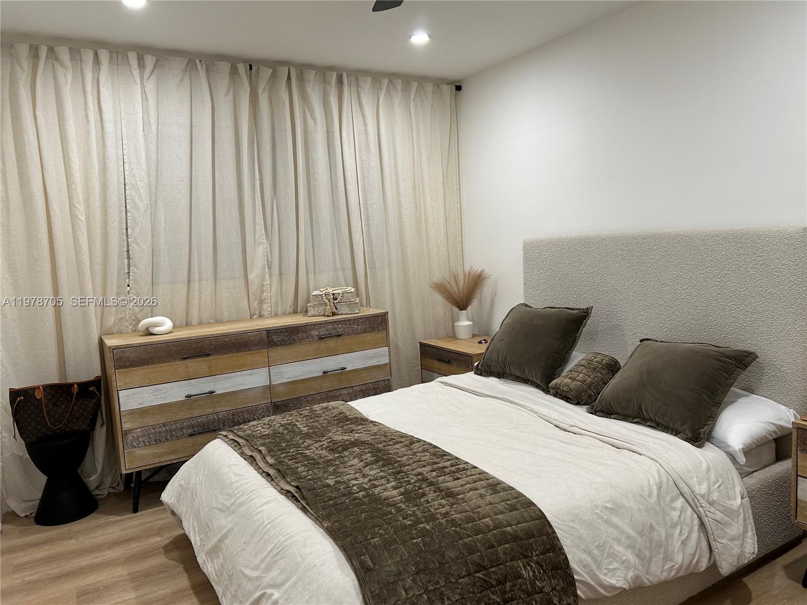 15915 Southwest 103rd Place Miami, FL 33157 - Photo 15 of 17 a bedroom with a bed and a chair
