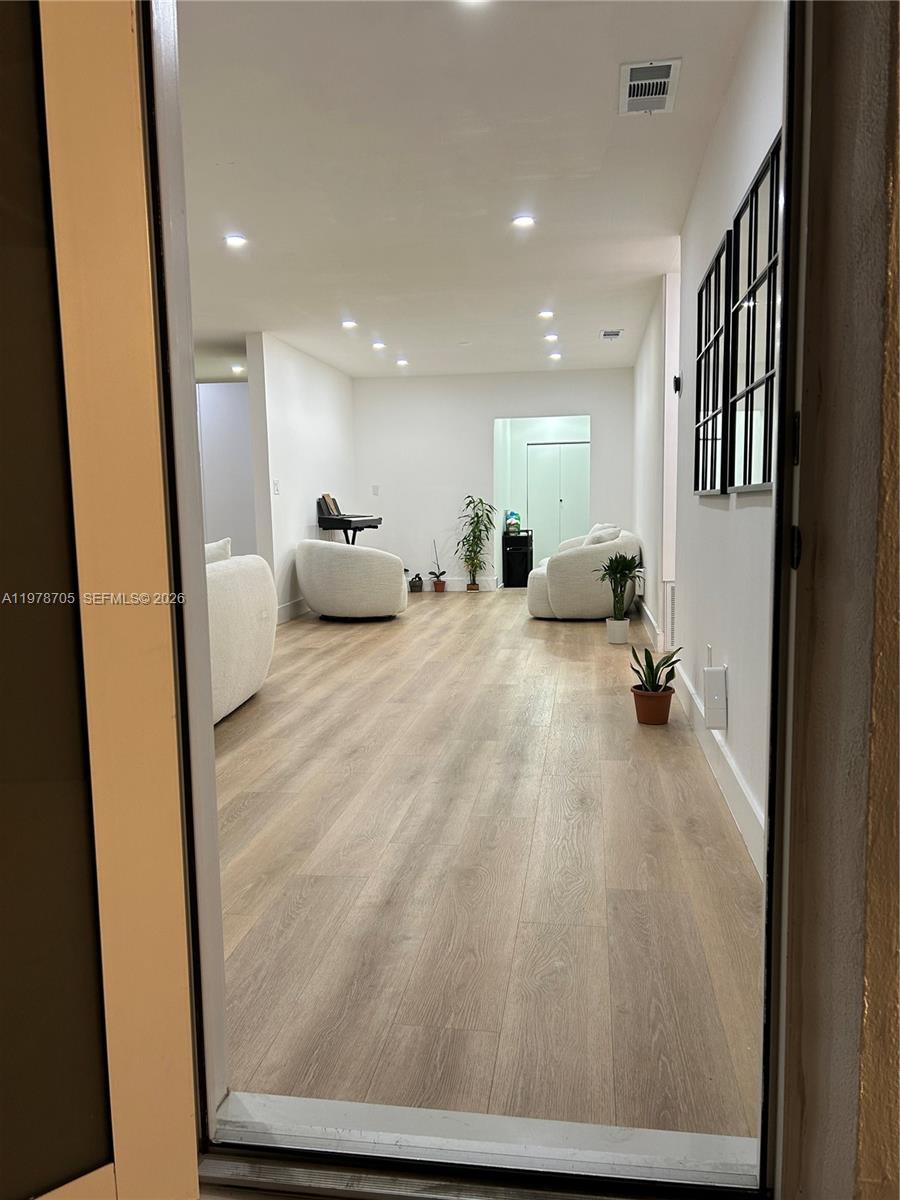 15915 Southwest 103rd Place Miami, FL 33157 - Photo 2 of 17 a view of a livingroom with furniture and a hallway