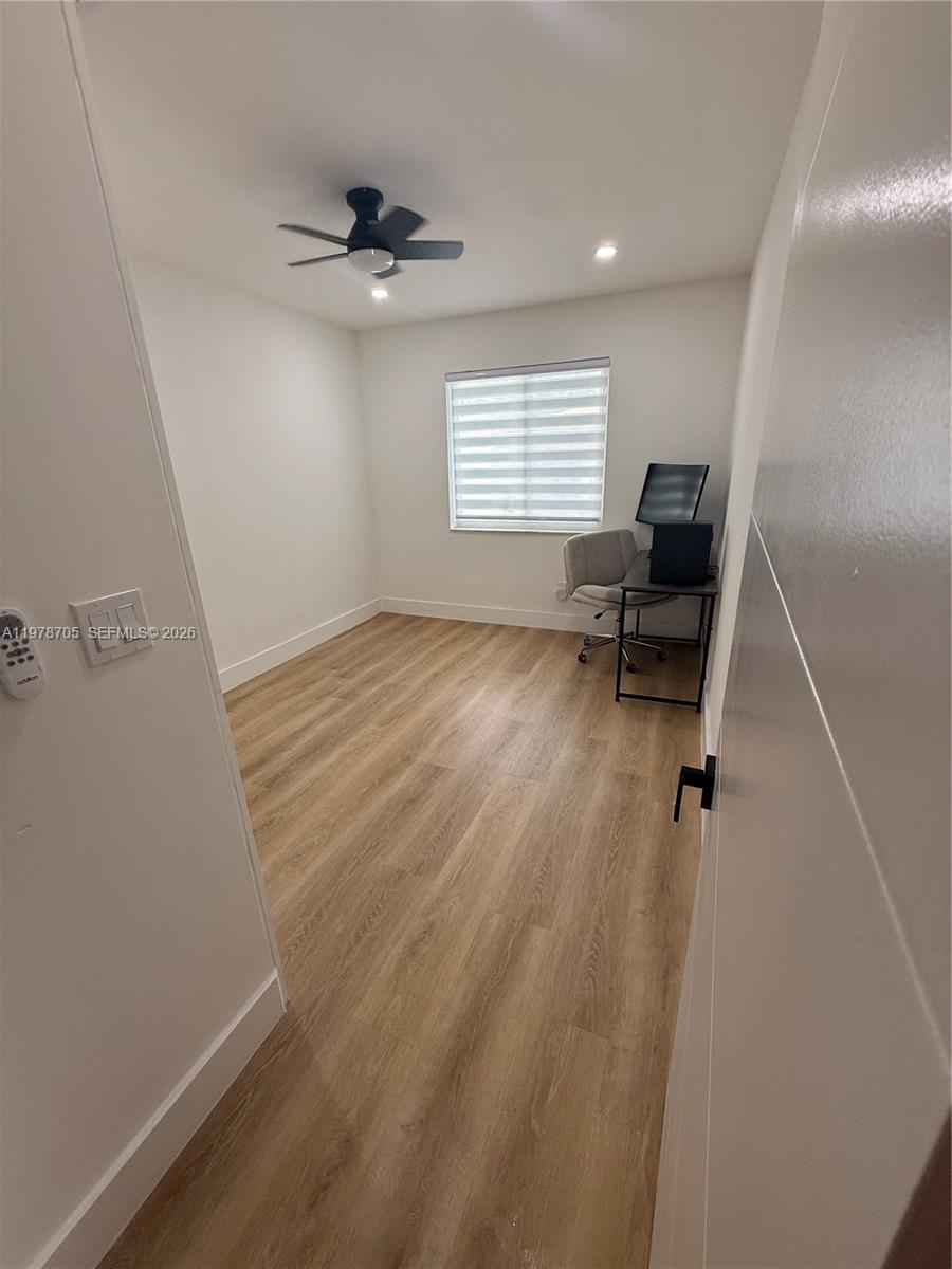 15915 Southwest 103rd Place Miami, FL 33157 - Photo 7 of 17 a view of livingroom with hardwood floor and a ceiling fan