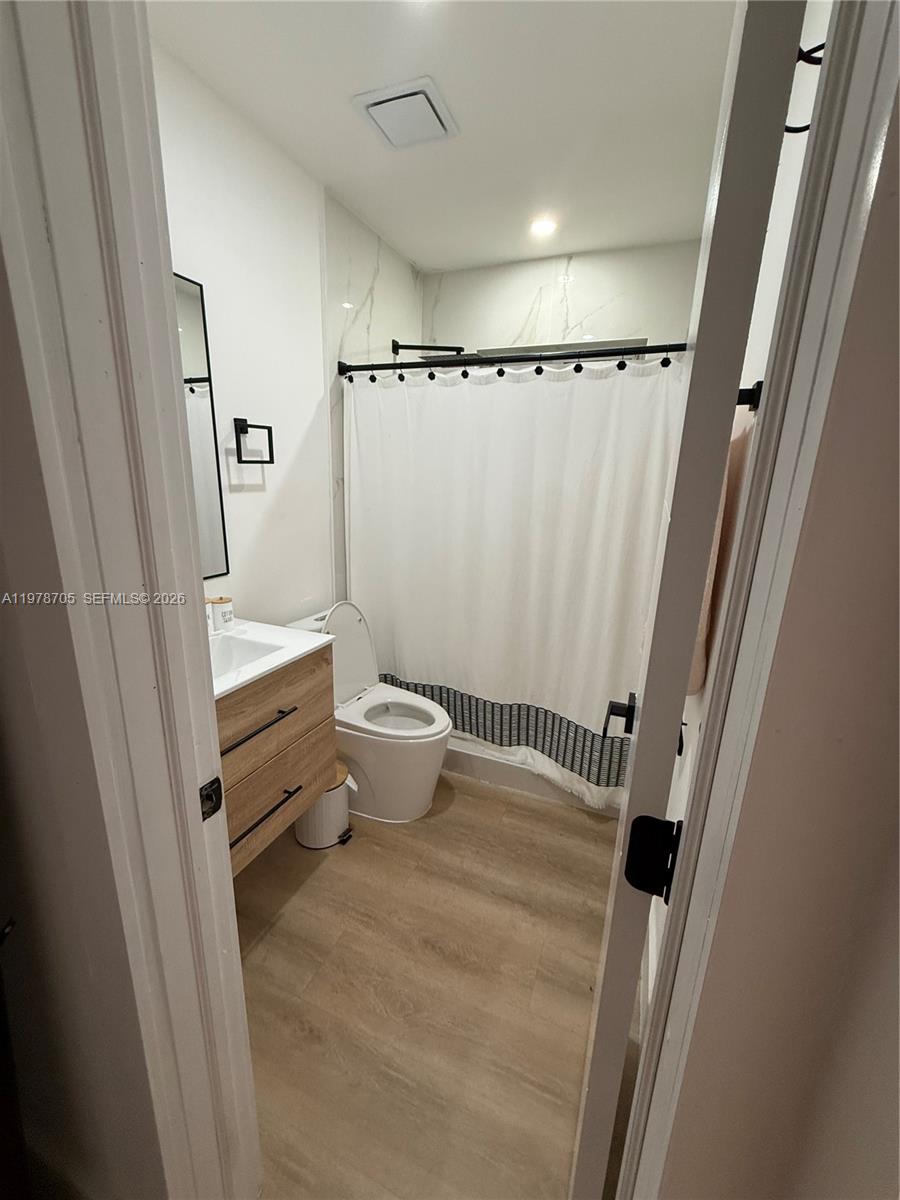 15915 Southwest 103rd Place Miami, FL 33157 - Photo 9 of 17 a bathroom with a sink and a mirror