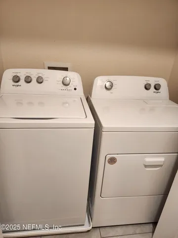 a utility room with dryer and washer