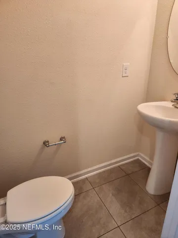 a bathroom with a toilet and a sink