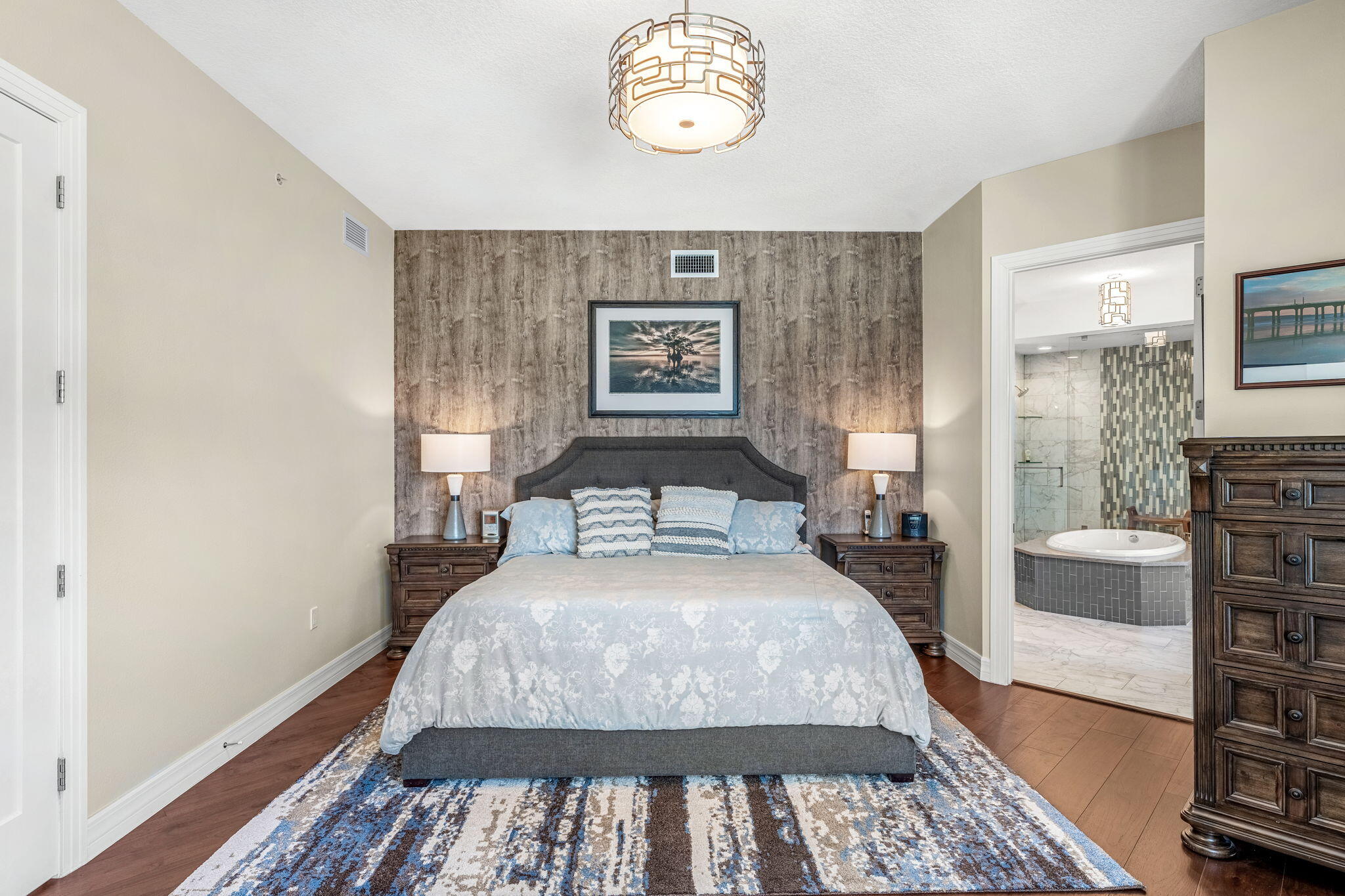 1725 North Hwy A1A, Unit 401 Indialantic, FL 32903 - Photo 12 of 39 a bedroom with a bed and a table in it