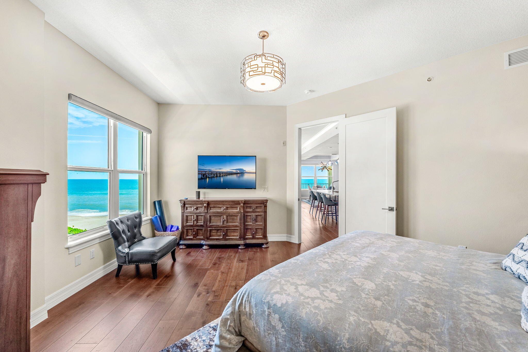 1725 North Hwy A1A, Unit 401 Indialantic, FL 32903 - Photo 13 of 39 a bedroom with bed and a large window