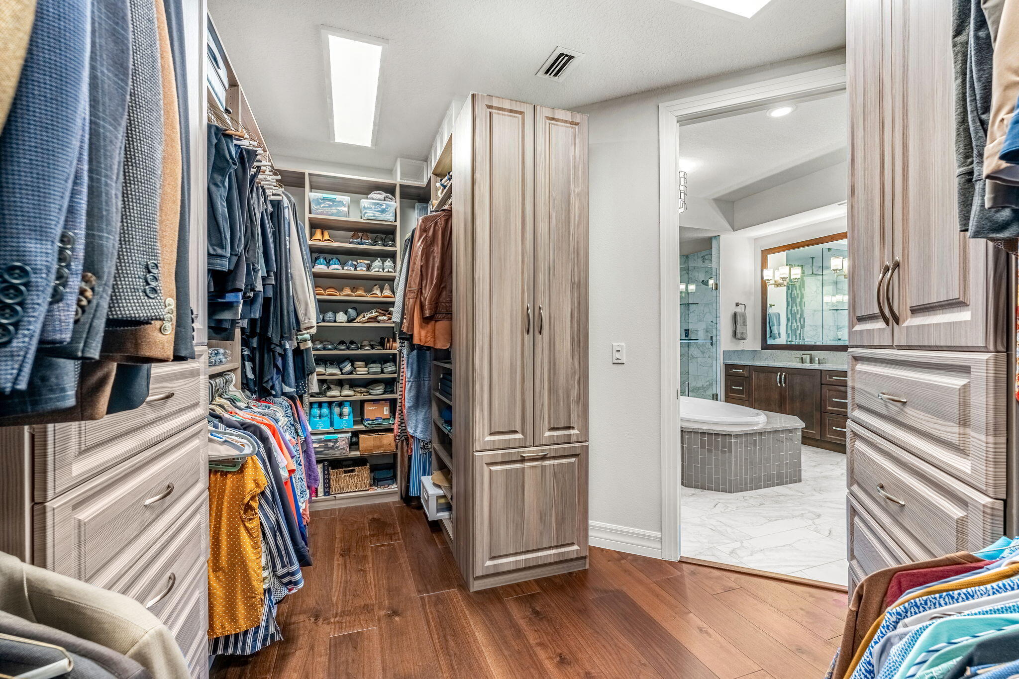 1725 North Hwy A1A, Unit 401 Indialantic, FL 32903 - Photo 16 of 39 a view of walk in closet with clothes and shoes