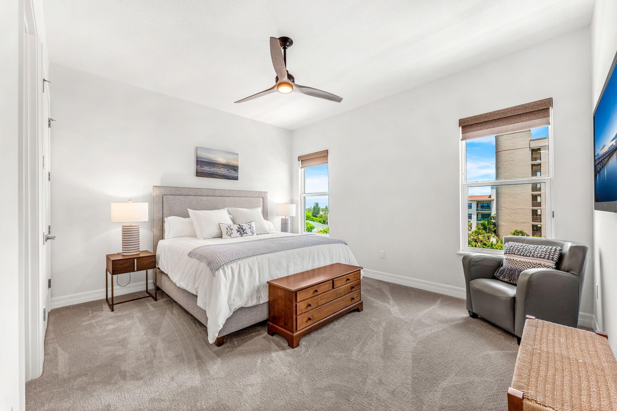 1725 North Hwy A1A, Unit 401 Indialantic, FL 32903 - Photo 17 of 39 a spacious bedroom with a bed couch and a window