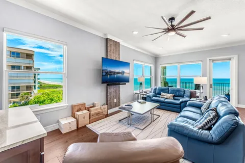 a large kitchen with stainless steel appliances granite countertop lots of counter top space and wooden floor