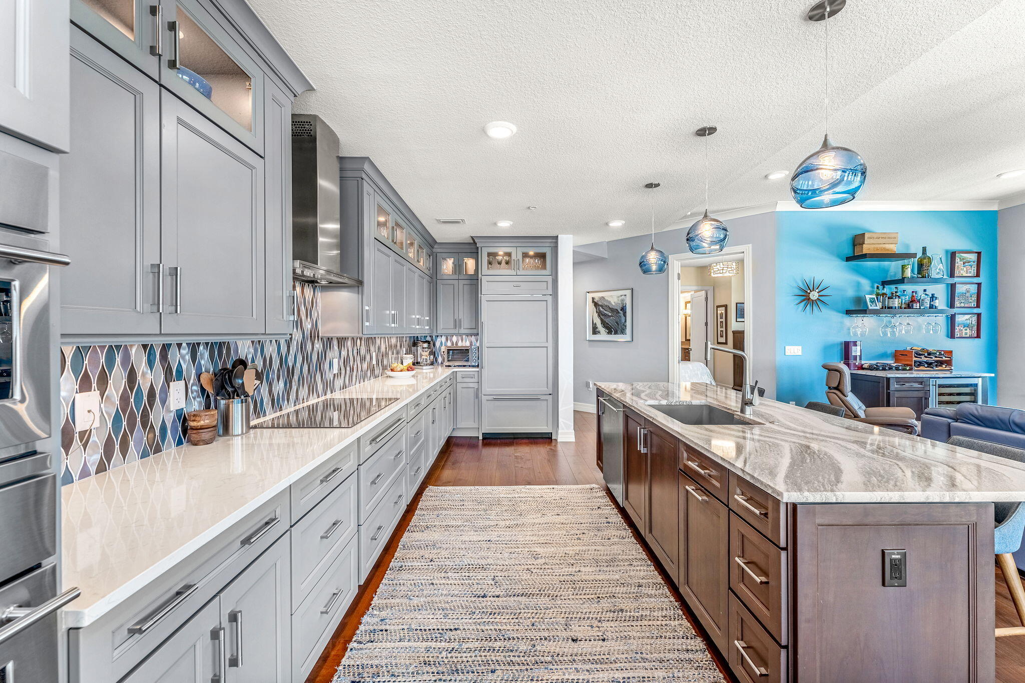 1725 North Hwy A1A, Unit 401 Indialantic, FL 32903 - Photo 6 of 39 a large kitchen with stainless steel appliances granite countertop lots of counter top space and wooden floor