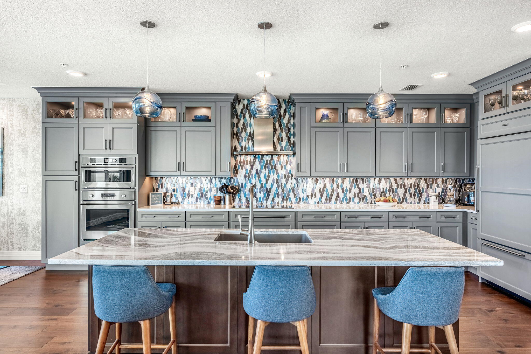 1725 North Hwy A1A, Unit 401 Indialantic, FL 32903 - Photo 7 of 39 a kitchen with cabinets table and chairs