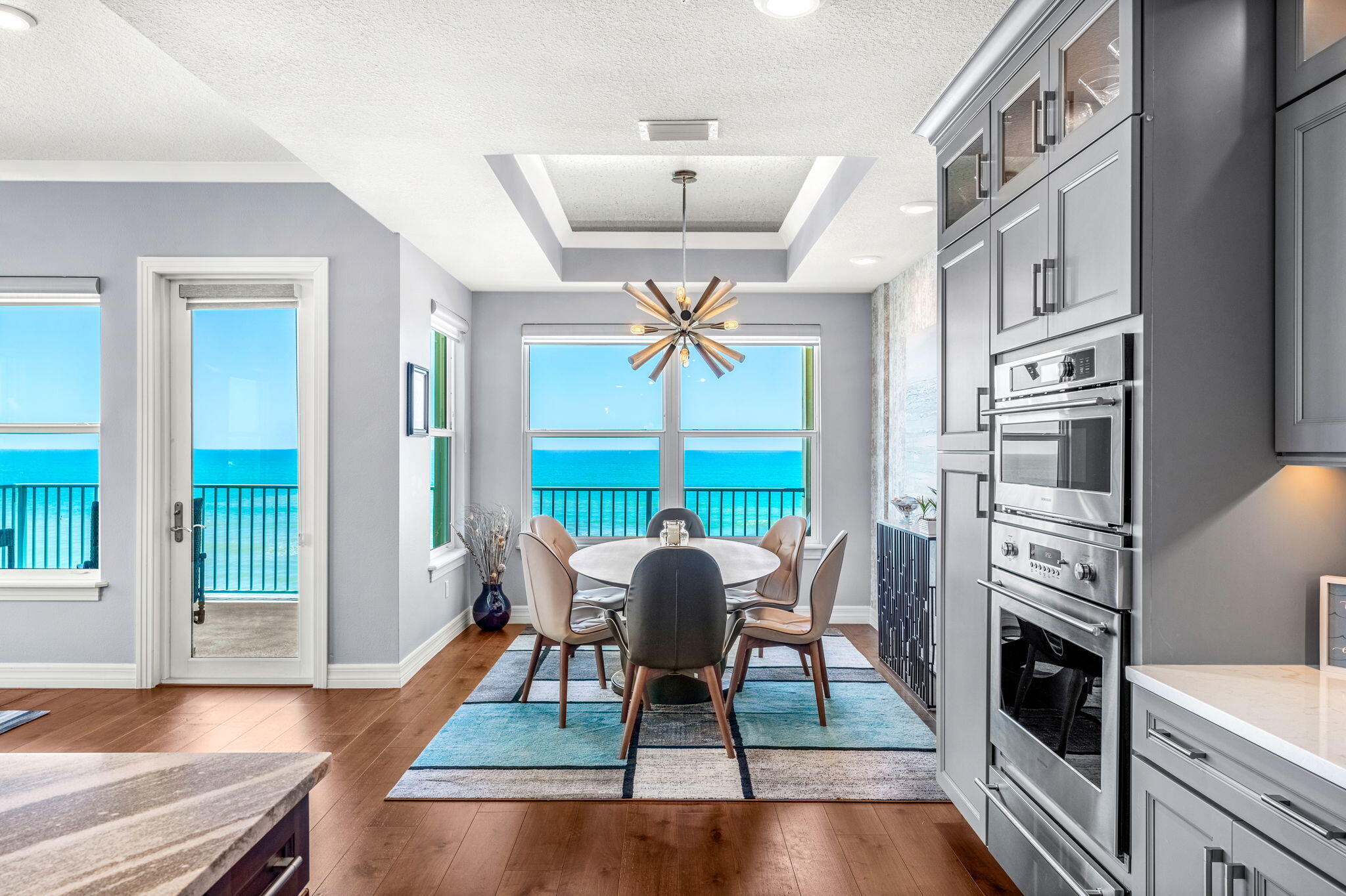 1725 North Hwy A1A, Unit 401 Indialantic, FL 32903 - Photo 8 of 39 a view of a dining room with furniture window and wooden floor