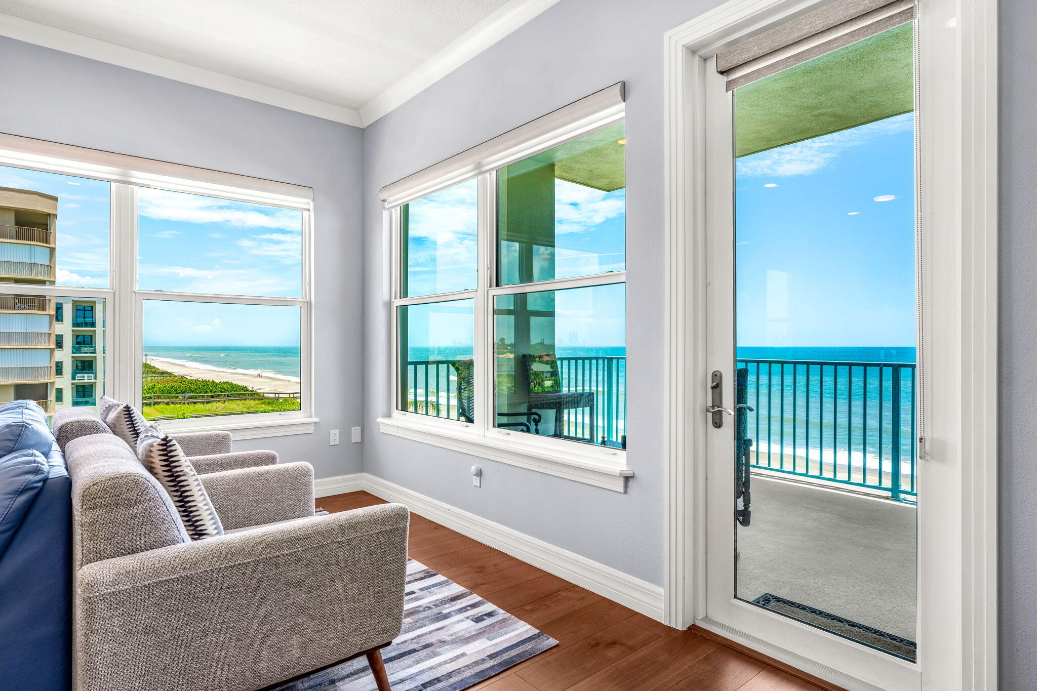 1725 North Hwy A1A, Unit 401 Indialantic, FL 32903 - Photo 9 of 39 a living room with furniture and a window