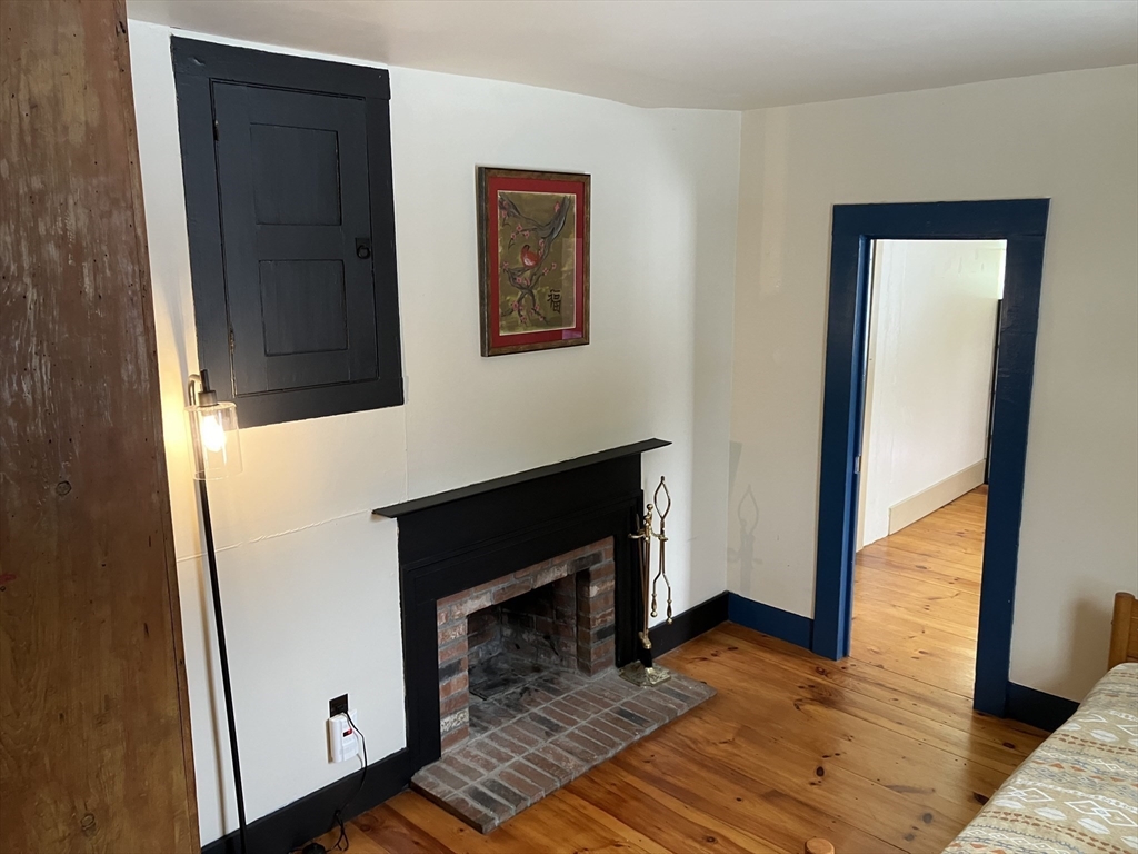 103 East Hawley Road Hawley, MA 01339 - Photo 12 of 34 a view of a livingroom with wooden floor and a fireplace