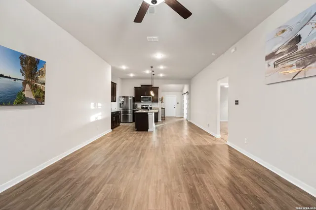 a view of kitchen with furniture and wooden floor