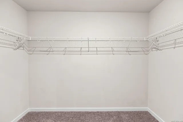 a view of a room with racks on the wall