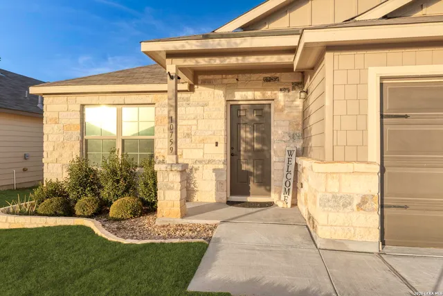 a front view of a house with a outdoor shower