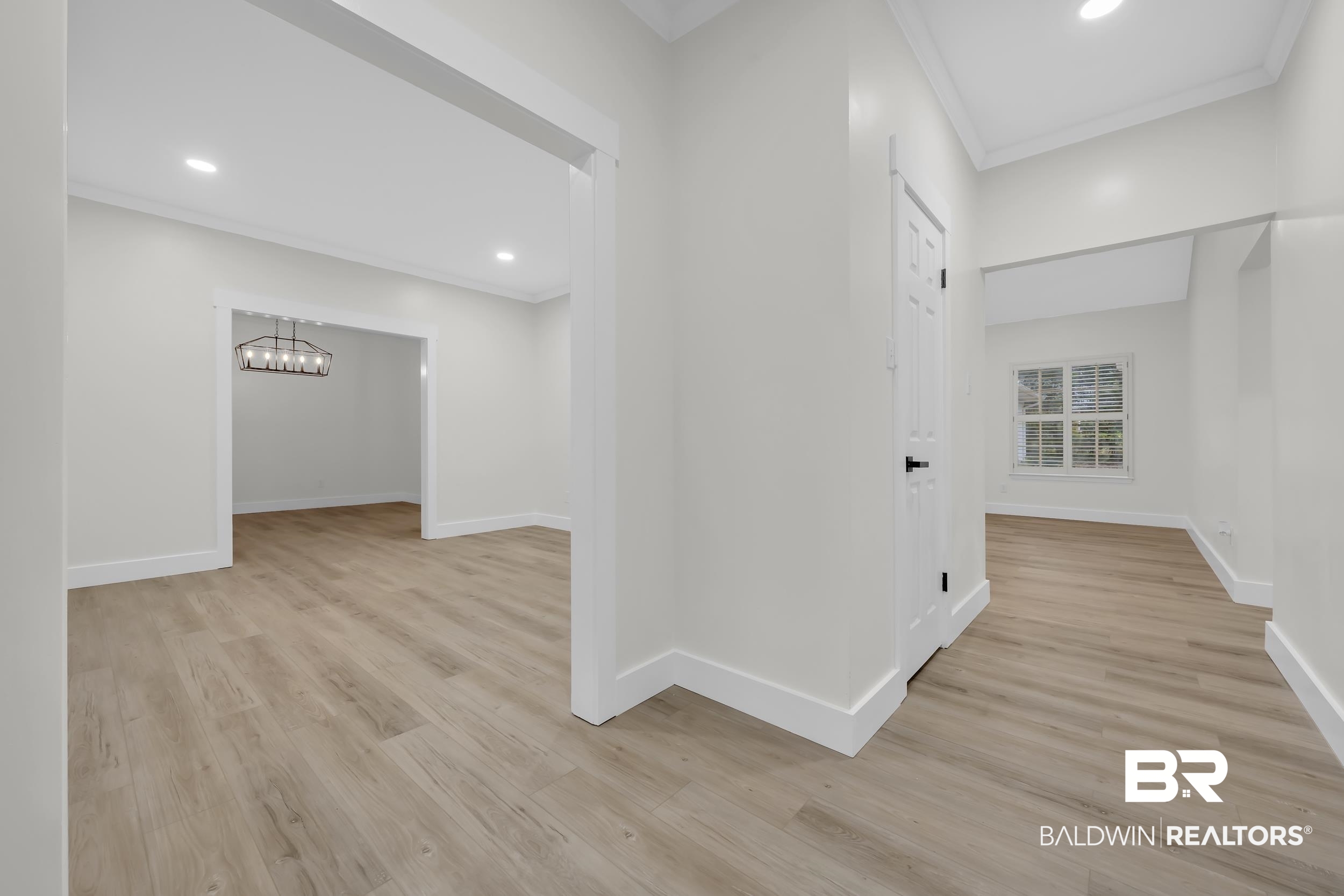 4924 Brooke Court Mobile, AL 36618 - Photo 5 of 34 Corridor with light wood-style flooring, crown molding, recessed lighting, and a chandelier