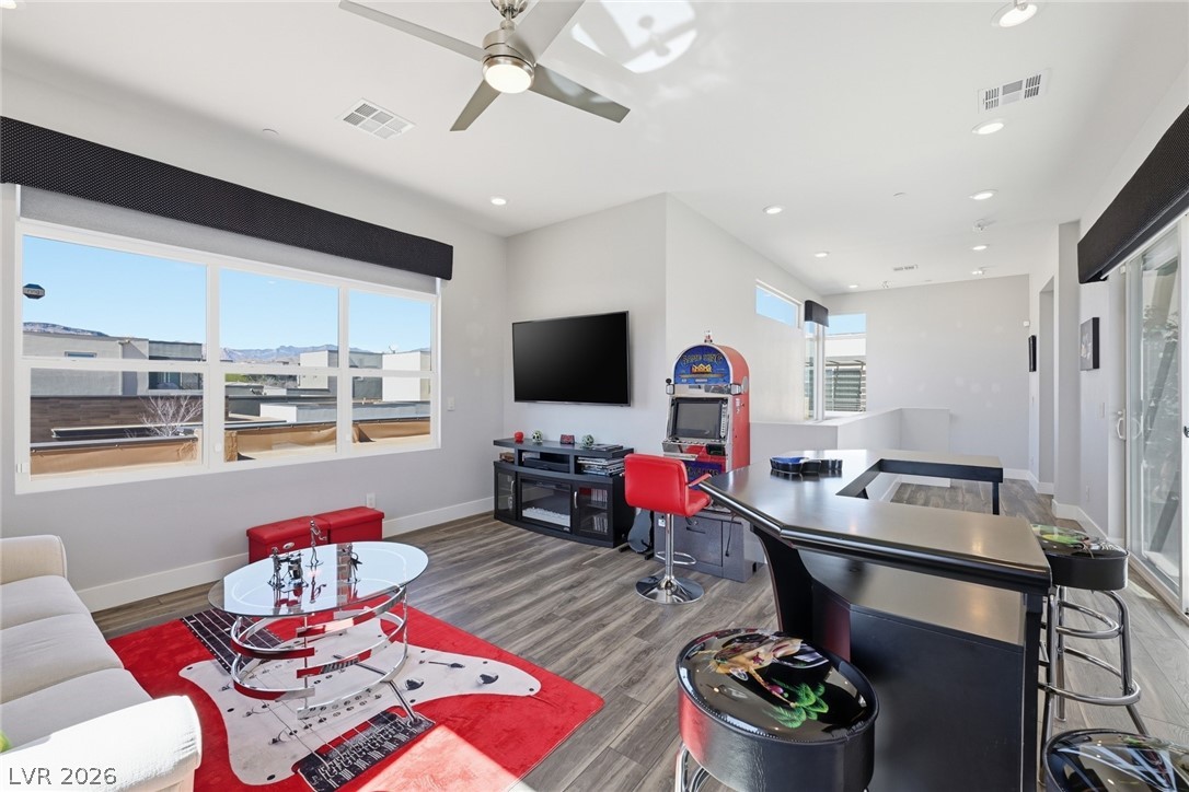 4246 Swift Street Las Vegas, NV 89135 - Photo 31 of 71 Living area featuring wood finished floors, ceiling fan, and recessed lighting