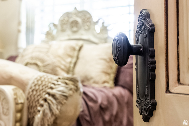 694 West Cephus Road Draper, UT 84020 - Photo 70 of 148 Ornate black door hardware on a cream-colored door