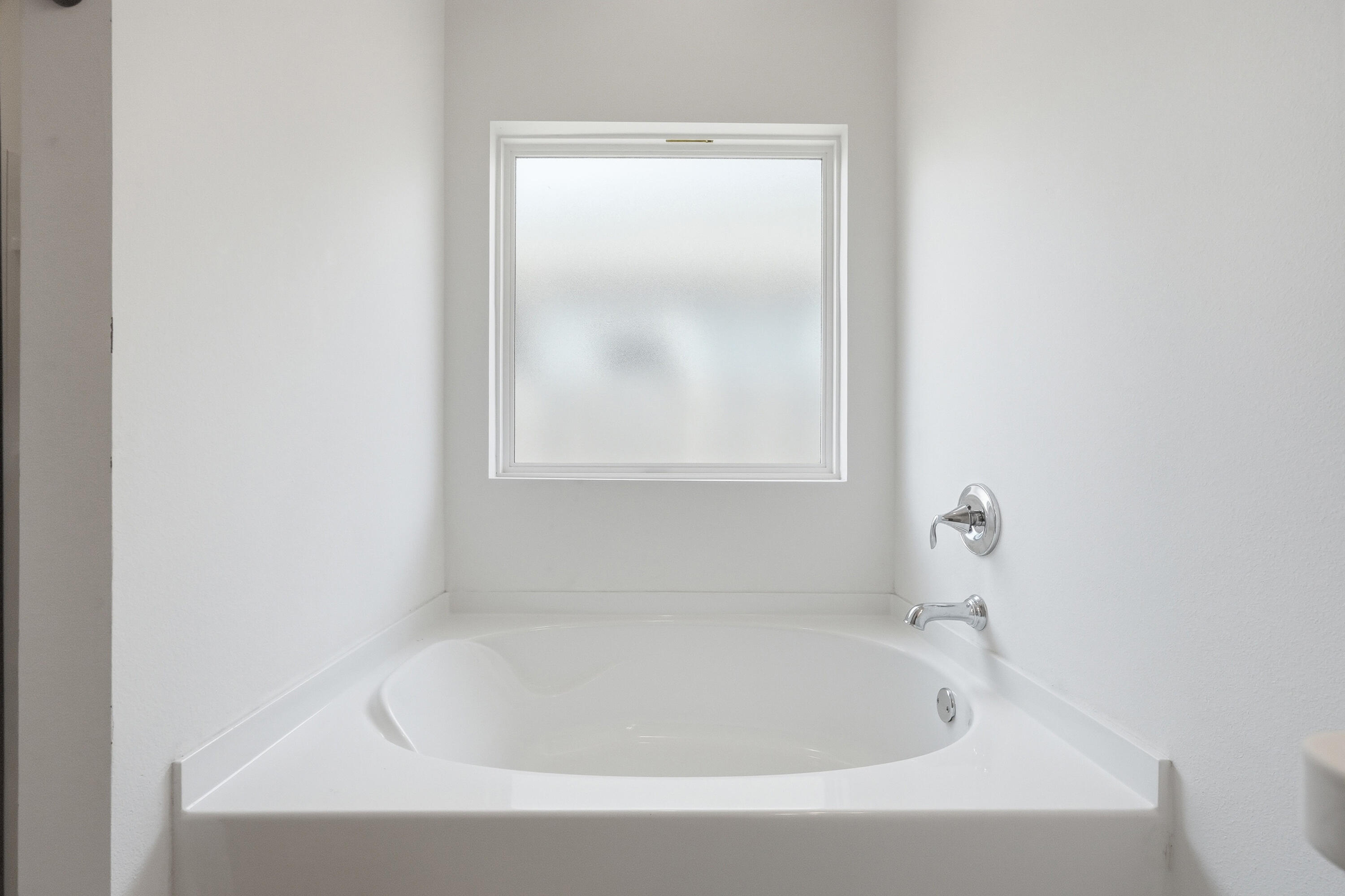 125 Blooming Cove Crestview, FL 32539 - Photo 18 of 55 a white bath tub sitting next to a window