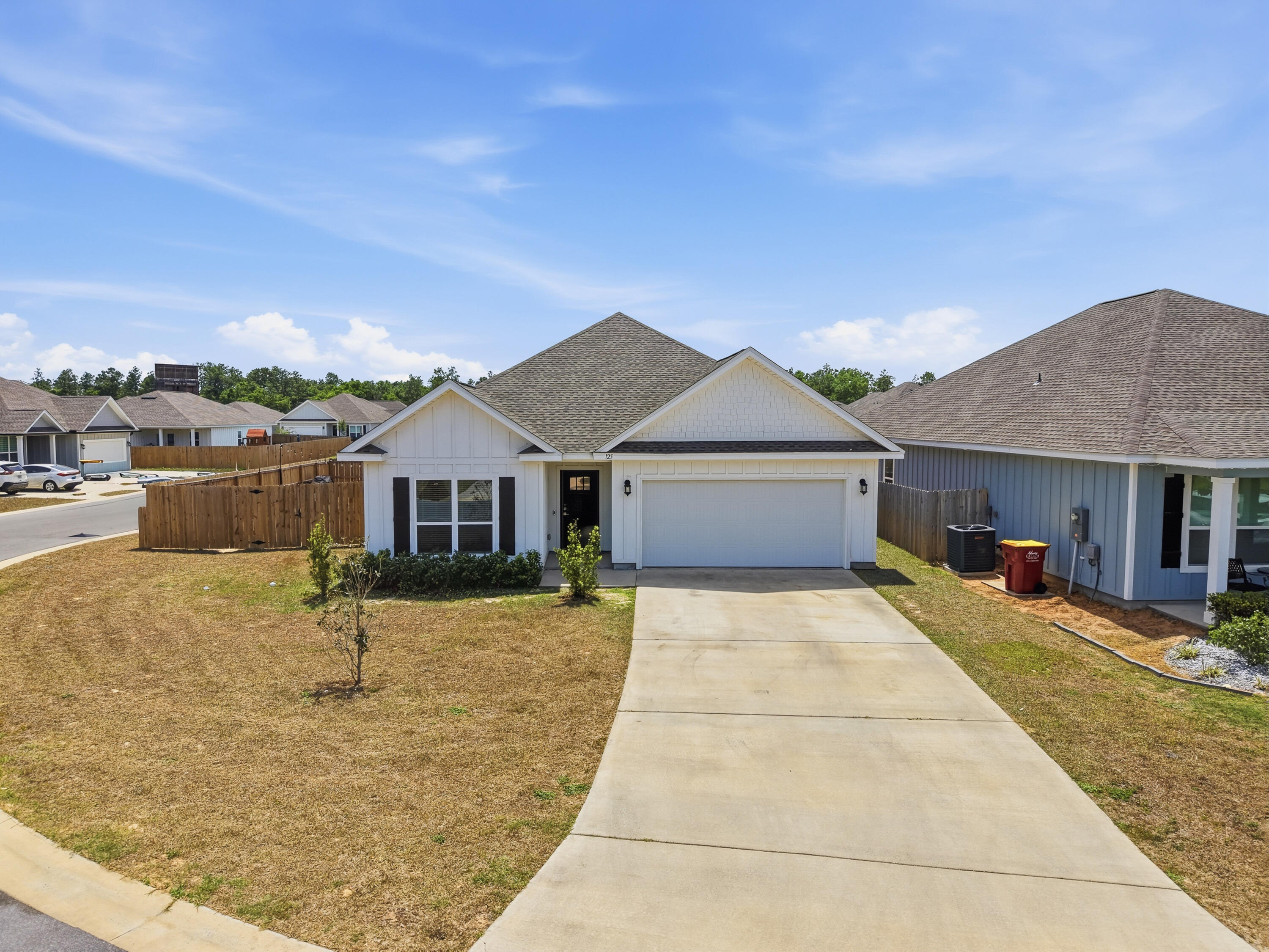 125 Blooming Cove Crestview, FL 32539 - Photo 52 of 55 a front view of a house with a yard