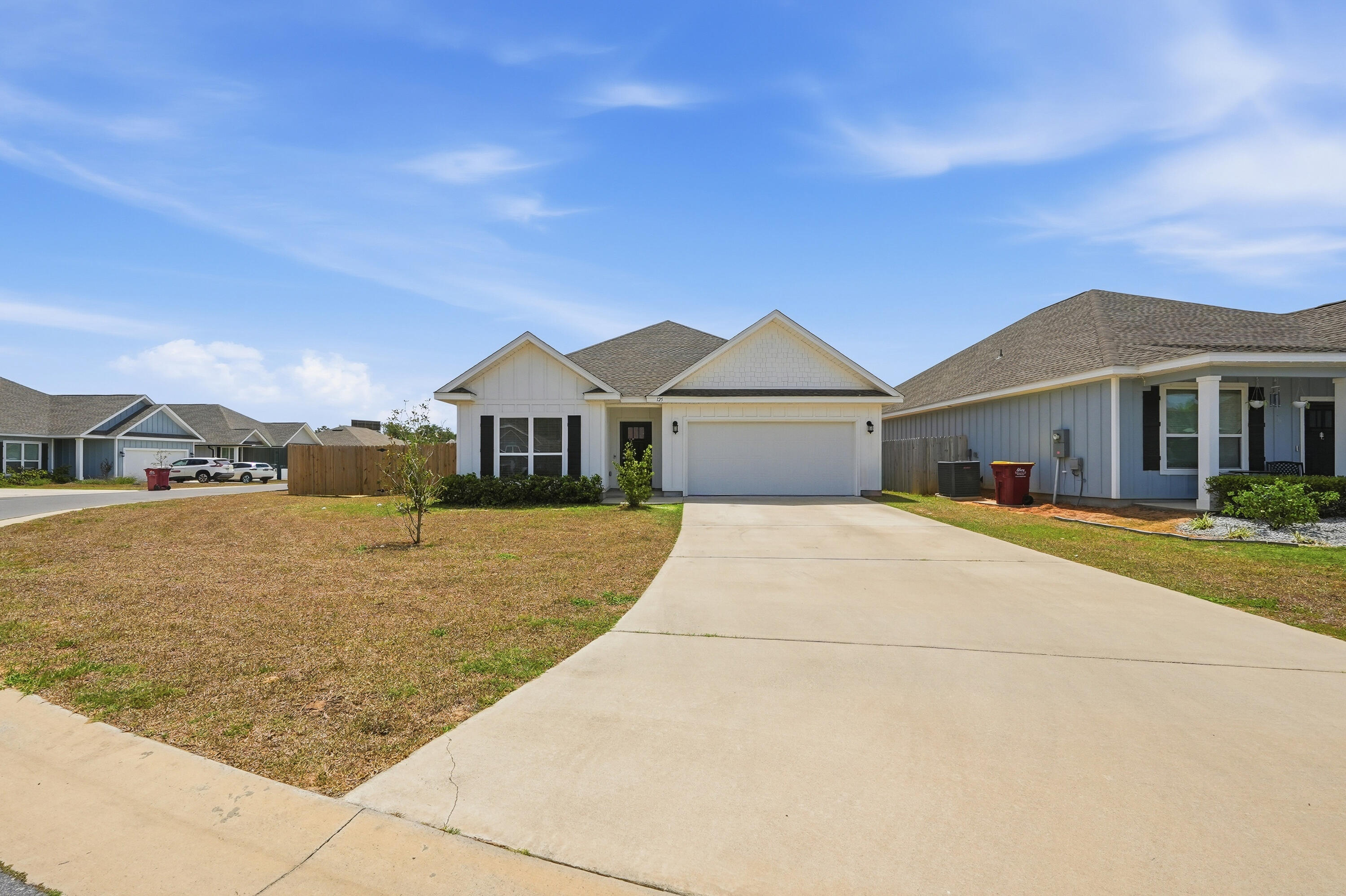 125 Blooming Cove Crestview, FL 32539 - Photo 54 of 55 a front view of a house with a yard