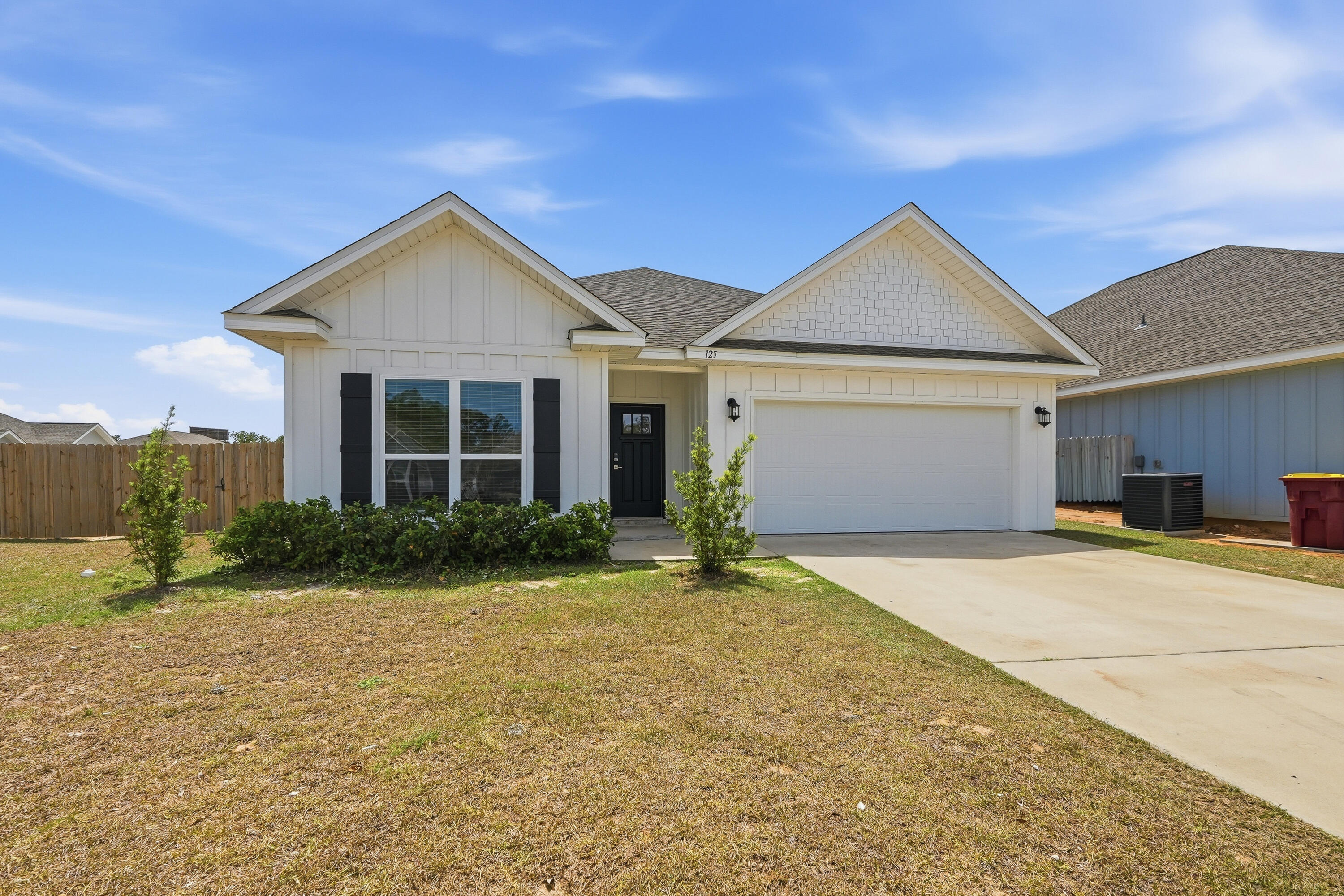 125 Blooming Cove Crestview, FL 32539 - Photo 55 of 55 a front view of a house with a yard and garage