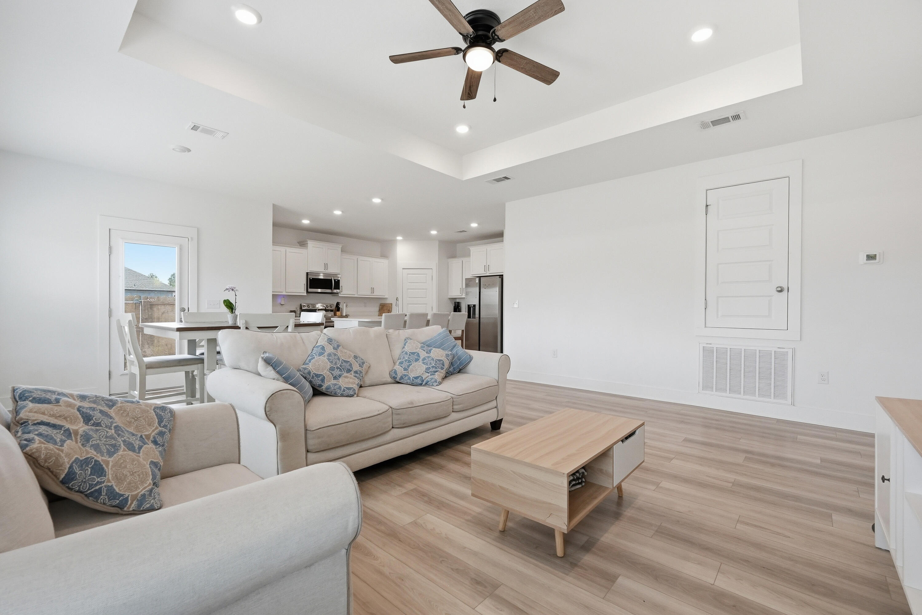 125 Blooming Cove Crestview, FL 32539 - Photo 6 of 55 a living room with furniture kitchen view and a wooden floor