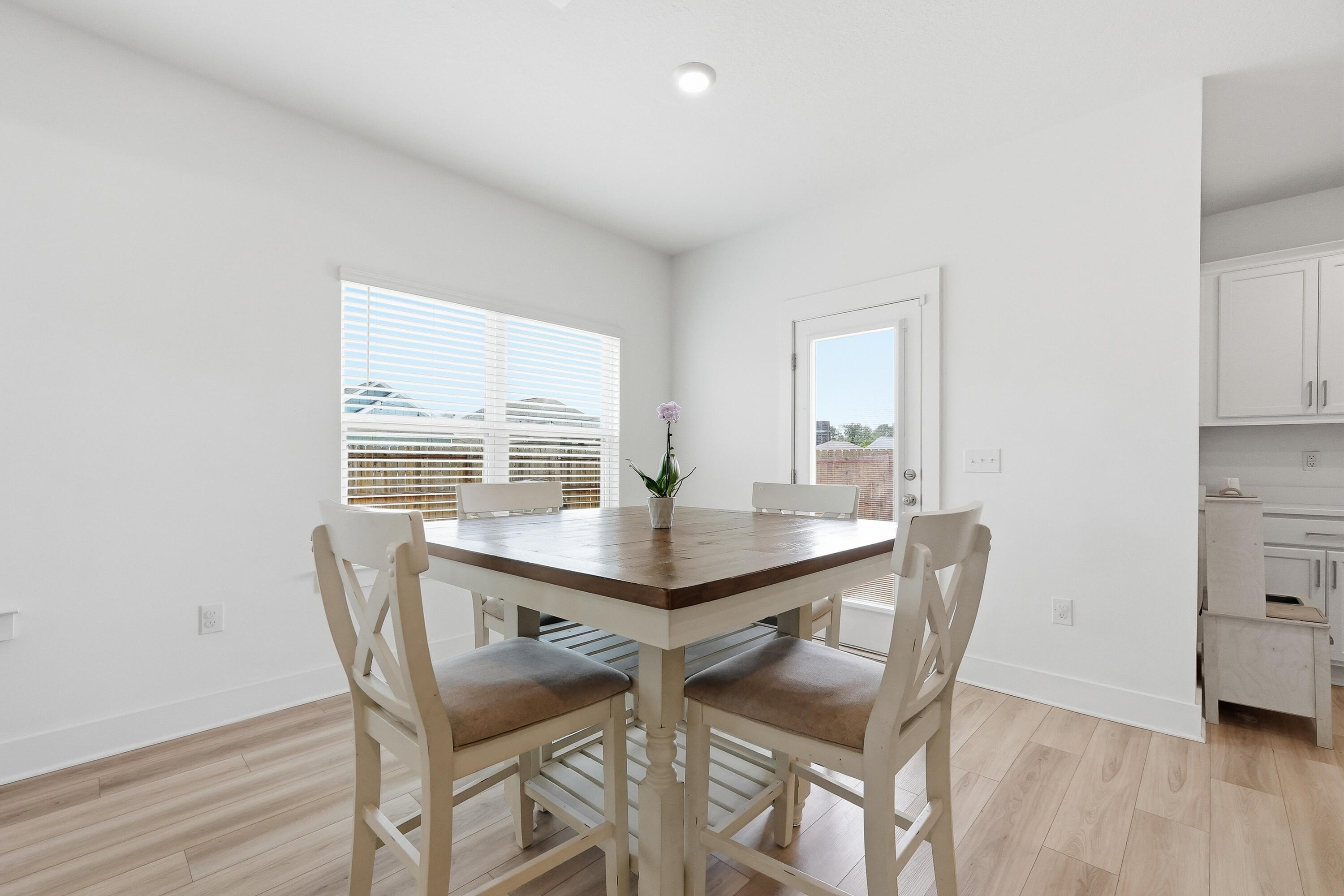125 Blooming Cove Crestview, FL 32539 - Photo 7 of 55 a view of a dining room with furniture and wooden floor