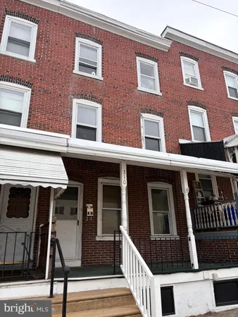 a view of a brick building with many windows