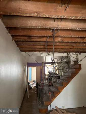 a hallway with table and chairs